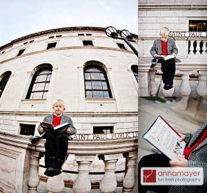 A boy reading a book outside Central Library in Rice Park, downtown Saint Paul