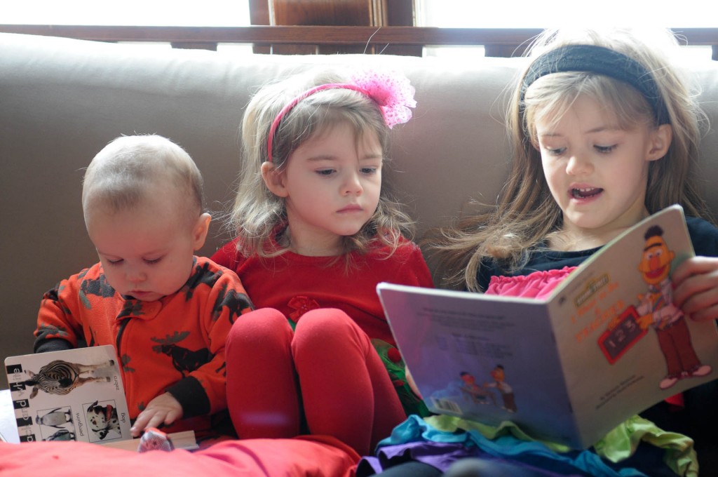 three kids reading